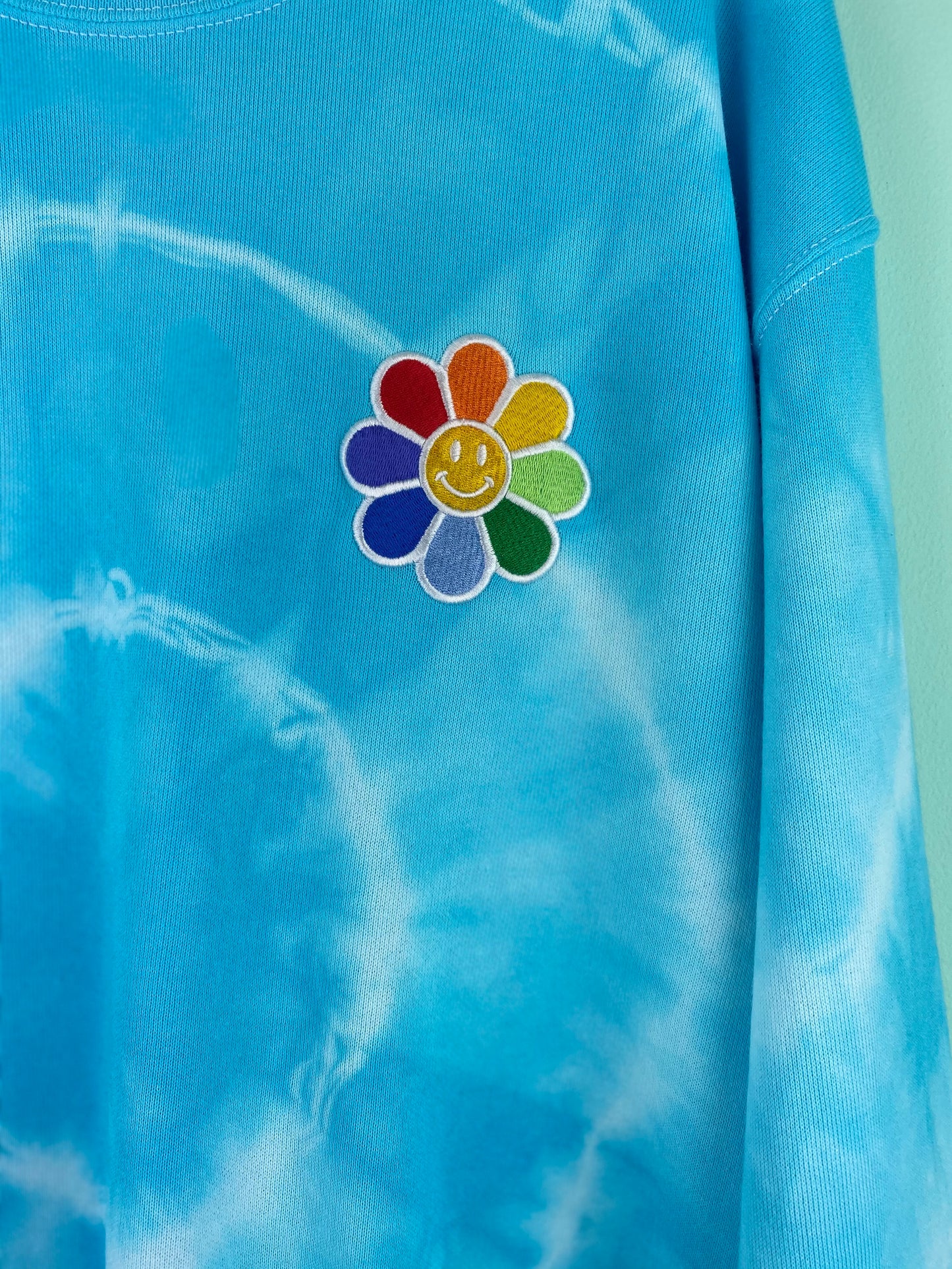 Unisex Smiley Face Daisy Tie Dye Pride Rainbow Embroidered Sweatshirt in Blue